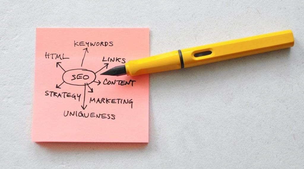 a pink post-it with notes on it