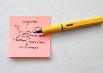 a pink post-it with notes on it