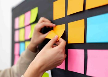 post-its on a black wall