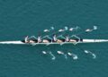 people rowing together
