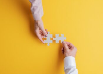 Hand and puzzle