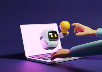 A hand writing on a computer and a small robot on a screen