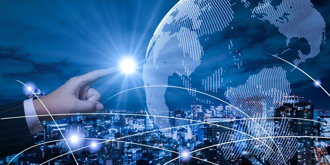 Hand touching a planet with a bright light